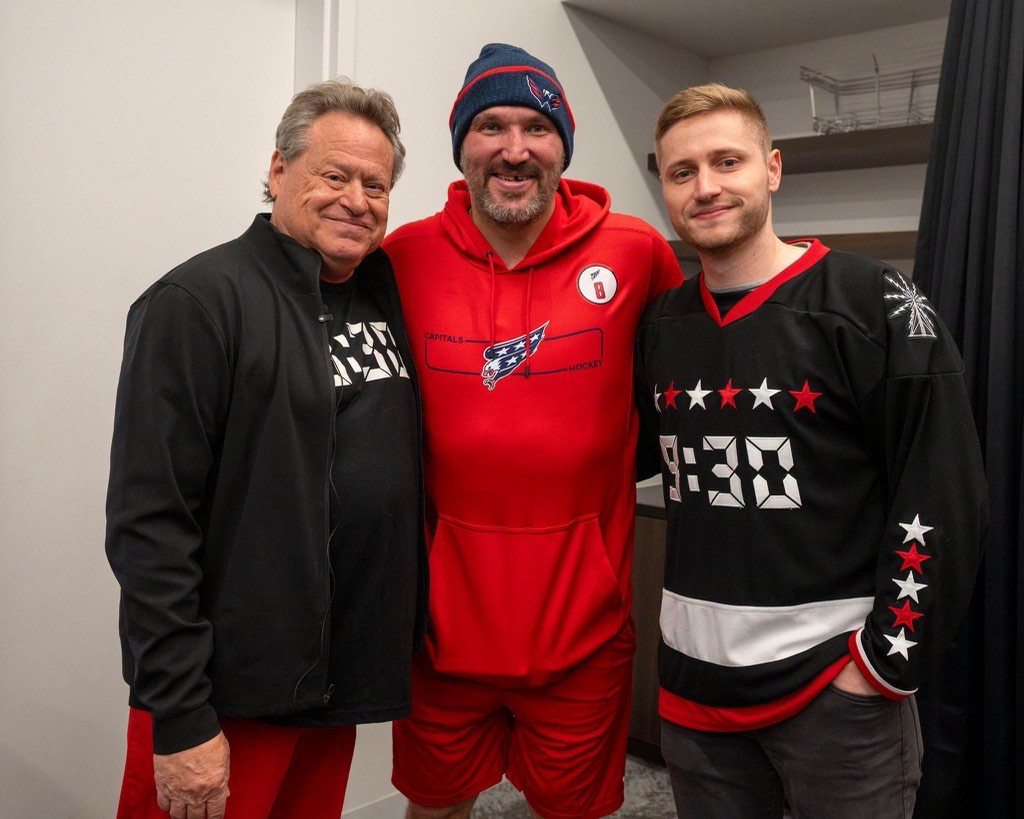 Seth Hurwitz in a 9:30 shirt, Alex Ovechkin, and a younger man in a 9:30 hockey jersey, posing backstage.